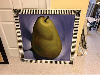 Large framed painting of a green pear with black-and-white patterned frame.
