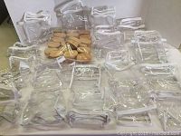 Photo of clear plastic zippered containers arranged on a flat surface.