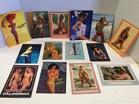 Image of all 14 postcards displayed on white background showing variety of women in swimsuits and beachwear with California and nearby locations themes.
