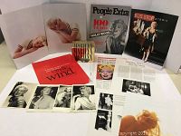 Overall shot showing all items in the Marilyn Monroe collection including the card box, photos, magazine, and articles laid out flat.