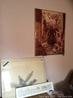 Photo showing flower painting on wall and damaged framed print below it on chair.