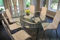 Six chairs around a glass-top table showing overall set