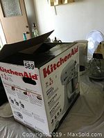 KitchenAid Artisan mixer in original box with lid open