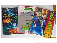 Three items: laminated Pokemon movie poster, TMNT Cowabunga mirror, framed Power Rangers picture