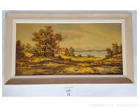 Hand painted oil landscape painting framed in light wood, showing rural scene with trees, house and river.