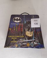 Closed Batman Returns collectors case featuring Batman and Batmobile artwork, labeled to hold 12 figures.
