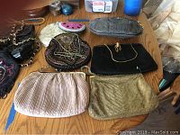 Overview photo of all six vintage purses and clutches arranged on a wooden surface.