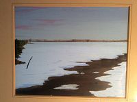 Full view of the framed original landscape painting showing snowy river scene with pink sky tones.