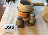 Open pottery pot with cream, brown and orange coloring shown with Mid Century Modern salt and pepper shakers in front