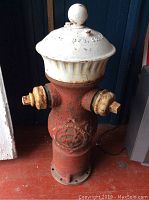 Full front view showing overall form, dual side outlets, base flange and paint condition