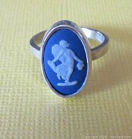 Close-up front view of the vintage Wedgwood blue and white cameo ring set in sterling silver band