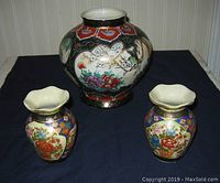 Photo showing all three Oriental porcelain vases placed on dark fabric, highlighting size difference and overall decoration