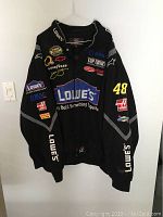 Front view of black Lowe's racing jacket with detailed sponsor logos and number 48 on sleeve