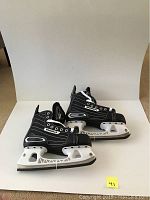 Pair of black Tackla Shift Quick Blade hockey skates in senior size 8, displayed side by side showing profile and design details.