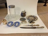 All thirteen items, various small decorative and kitchen items displayed against a white backdrop