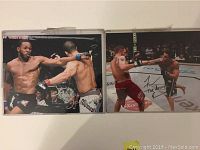 Photo showing two 8x10 photos of MMA fighters during fights, one has visible autograph of Jon Bones Jones