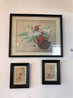 Set of 4 painted silk wall art, 1 large and 3 smaller framed pieces, floral and bird themes.