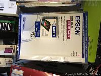 Stack of Epson Photo Quality Inkjet Printer Paper in various packages