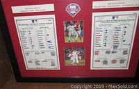 Full front view of framed display showing both roster sheets, central photos, and Phillies logo.