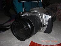 Canon Rebel 2000 EOS camera with Canon EF 28-80mm lens attached, showing left side angle