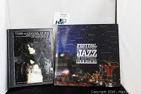 Front covers of the two hard cover collectible books, "This is Gonna Hurt" by Nikki Sixx and "Festival International de Jazz de Montreal"