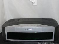 Front view showing BOSE logo and control buttons for power, volume, source, skip/scan, and stop/eject.