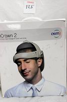 Box showing OSIM uCrown 2 head massager branding and an image of a man wearing the device.