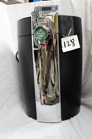Front view of the KRUPS Heineken BeerTender keg dispenser showing the chrome tap with Heineken logo and overall black and chrome body.