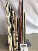 Side view of 10 sculpture books showing titles including Marlborough, Pablo Serrano, Eduardo Chillida, and Newton British Sculpture.