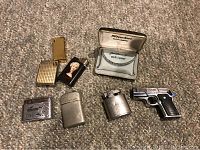 Overview of 9 vintage lighters including Starlon in case, 945M gun lighter, Dynasty, and others.