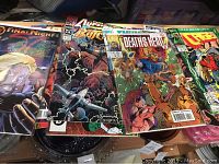 Four comic books visible laid side by side showing titles The Final Night, Avengers, Death's Head II, and Crash.