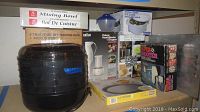 Photo showing all boxed items including Super Shooter, Magical Butter machine, Braun hand blender and chopper, mixing bowls box, food dehydrator