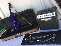 Entire lot: purple electric violin in case, bow, headphones, Behringer amplifier