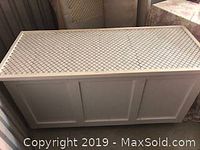 Top view showing lattice patterned surface of the wooden cabinet counter.
