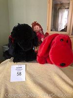 Three Beanie Babies: black dog Gigi on left, red dog on right, Snazzy Sabrina doll in middle