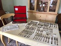 Full spread of flatware pieces displayed on table