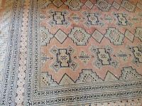 Central section of rug showing repeating geometric medallions