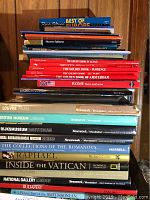 Stack of 39 books related to European art, museums, and travel destinations including Vatican and Venice, showing titles and colorful covers.