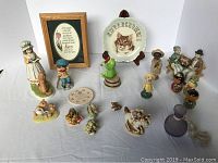 Wide view of vintage Lefton and assorted figurines including decorative plate and numerous small ceramics.