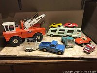 Overview of all vehicles and figures on countertop.