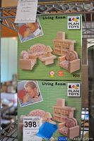 Front of Plan Toys Living Room miniature dollhouse furniture box showing the assembled furniture items and product label with item number 9015