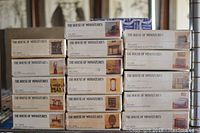 Stack of 16 boxed miniature dollhouse furniture items labeled The House of Miniatures. Boxes show various furniture types and images.