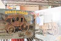 Photo showing boxed wooden stage coach model kit labeled as an authentic wooden wagon kit.