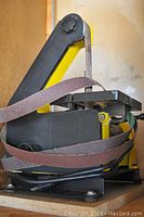 Central Machinery belt and disc sander with sanding belt visible, showing overall condition and wear.