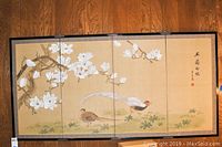 Full view of four fabric panels arranged as wall art showing magnolia blossoms and pheasants on beige background with decorative borders.