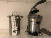Both Breville juicer and Denmark pot shown side by side; stainless steel finish