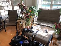 Overall view showing loveseat on right, single chair on left and one ottoman in center