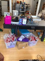 Full view of lot showing kitchen appliances, canisters, warming trays and clothes hangers