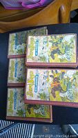 Photo displays five stacked Dare Boys books showing colorful illustrated covers with action scenes and title text.
