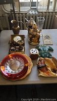 Overview of mixed lot including glass bowls, figurines, clock, vase, and other decorative items.